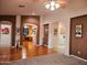 Bright living room with a ceiling fan, hardwood floors, and views into other rooms at 5028 S Peachwood Dr, Gilbert, AZ 85298
