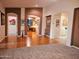 Open concept living room with hardwood floors, neutral paint, and archways to other rooms at 5028 S Peachwood Dr, Gilbert, AZ 85298