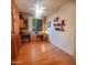 Spacious office with hardwood floors, built-in desk and shelves, and bright natural light at 5028 S Peachwood Dr, Gilbert, AZ 85298