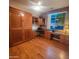 Well-appointed home office with custom built-ins and hardwood flooring at 5028 S Peachwood Dr, Gilbert, AZ 85298