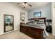 Spacious Primary bedroom with ensuite bathroom access and plenty of natural light at 6202 E Mckellips Rd # 91, Mesa, AZ 85215