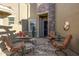 Cozy courtyard with seating area and a wrought iron gate at 6202 E Mckellips Rd # 91, Mesa, AZ 85215