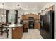 Modern kitchen with granite countertops and black appliances at 6202 E Mckellips Rd # 91, Mesa, AZ 85215