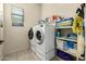 Convenient laundry room with washer, dryer, and storage shelves at 6202 E Mckellips Rd # 91, Mesa, AZ 85215