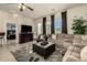 Open living room featuring a sectional sofa and fireplace at 6202 E Mckellips Rd # 91, Mesa, AZ 85215