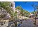 Peaceful water feature with lush foliage and a stone walkway at 6411 S River Dr # 11, Tempe, AZ 85283