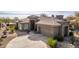 Single-story home with tile roof and desert landscaping at 7287 E Sunset Sky Cir, Scottsdale, AZ 85266