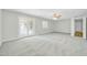 Primary bedroom with carpet, ceiling fan and access to backyard at 7357 W Canterbury Dr, Peoria, AZ 85345
