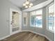 Bright dining area with backyard view and wood flooring at 7357 W Canterbury Dr, Peoria, AZ 85345