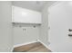 Bright laundry room with white cabinets at 7357 W Canterbury Dr, Peoria, AZ 85345
