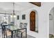 Dining area with glass-top table and modern chandelier at 7557 N Dreamy Draw Dr # 154, Phoenix, AZ 85020