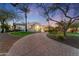 Brick driveway leading to a grand entrance of a beautiful home at 7635 E Poinsettia Dr, Scottsdale, AZ 85260