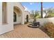 Peaceful courtyard patio with a water fountain, creating a serene ambiance at 7635 E Poinsettia Dr, Scottsdale, AZ 85260