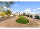 Landscaped side yard with a playground and grassy area at 7635 E Poinsettia Dr, Scottsdale, AZ 85260