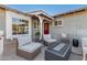 Relaxing patio with wicker furniture and a fire pit at 831 E Desert Park Ln, Phoenix, AZ 85020