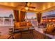 Relaxing covered patio with seating area and string lights at 831 E Desert Park Ln, Phoenix, AZ 85020