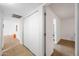 Bright hallway with tile floors and linen closet at 8837 N New World Dr, Glendale, AZ 85302