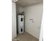 Laundry room with water heater and shelving at 8837 N New World Dr, Glendale, AZ 85302