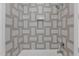 Clean bathroom with geometric patterned tile and bathtub at 100 W Northern Ave # 7, Phoenix, AZ 85021