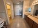 Large bathroom with double vanity, separate toilet area, and shower at 10154 W Lawrence Ln, Peoria, AZ 85345