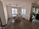 Bright dining room with wood table and four chairs at 10154 W Lawrence Ln, Peoria, AZ 85345