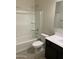 Modern bathroom with dark vanity and bathtub at 1088 W Sand Canyon Ct, Casa Grande, AZ 85122