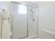 Bathroom featuring a tiled shower with sliding glass doors and a white toilet at 11360 E Keats Ave # 78, Mesa, AZ 85209