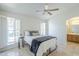 Bright bedroom with tile floors, ceiling fan, and windows offering natural light at 11360 E Keats Ave # 78, Mesa, AZ 85209