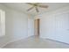 Neutral bedroom features tile flooring and white closet doors at 11360 E Keats Ave # 78, Mesa, AZ 85209