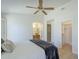 Bright bedroom with tile floors, ceiling fan, and access to a bathroom and closet at 11360 E Keats Ave # 78, Mesa, AZ 85209