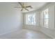 Bright bedroom with tile floors and windows with white shutters at 11360 E Keats Ave # 78, Mesa, AZ 85209