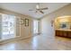 Bright bedroom with tile floors, ceiling fan, and window shutters at 11360 E Keats Ave # 78, Mesa, AZ 85209