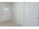 Bright entryway with tile flooring, coat closet, and half-glass front door at 11360 E Keats Ave # 78, Mesa, AZ 85209