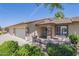Charming home featuring a well-manicured front yard and a cozy outdoor seating area at 11360 E Keats Ave # 78, Mesa, AZ 85209