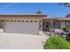 Charming home featuring a spacious garage, desert landscaping, and stone accents at 11360 E Keats Ave # 78, Mesa, AZ 85209