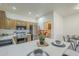 Well-lit kitchen featuring stainless steel appliances, warm wood cabinetry, and breakfast bar seating at 11360 E Keats Ave # 78, Mesa, AZ 85209