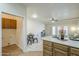 Bright kitchen with breakfast bar leading into dining and living areas with lots of sunlight at 11360 E Keats Ave # 78, Mesa, AZ 85209