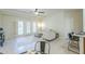 Bright, airy living room with neutral tones, ceiling fan, and patio access at 11360 E Keats Ave # 78, Mesa, AZ 85209