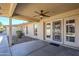 Covered patio with ceiling fan and double doors at 11360 E Keats Ave # 78, Mesa, AZ 85209