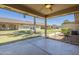 Covered patio with ceiling fan overlooking lush green common area, perfect for outdoor relaxation at 11360 E Keats Ave # 78, Mesa, AZ 85209