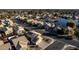 Aerial view of house and neighborhood near lake at 1212 E Butler Dr, Chandler, AZ 85225