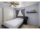 Bright bedroom with double door closet and TV at 1212 E Butler Dr, Chandler, AZ 85225