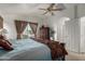 Spacious bedroom with large window and ceiling fan at 1212 E Butler Dr, Chandler, AZ 85225