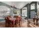 Bright dining room with hardwood floors and a large table at 1212 E Butler Dr, Chandler, AZ 85225