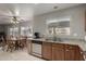 Kitchen with granite countertops, wooden cabinets, and breakfast nook at 1212 E Butler Dr, Chandler, AZ 85225