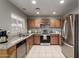 Kitchen boasts granite countertops and stainless steel appliances at 1212 E Butler Dr, Chandler, AZ 85225