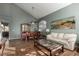 Living room with hardwood floors, off-white couch, and large artwork at 1212 E Butler Dr, Chandler, AZ 85225