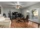 Living room with hardwood floors, sliding door to patio, and off-white couch at 1212 E Butler Dr, Chandler, AZ 85225