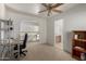 Home office with built-in shelving and view of the stairs at 1212 E Butler Dr, Chandler, AZ 85225