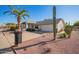 House exterior with a driveway, landscaping, and a tall cactus at 12307 W Westgate Dr, Sun City West, AZ 85375